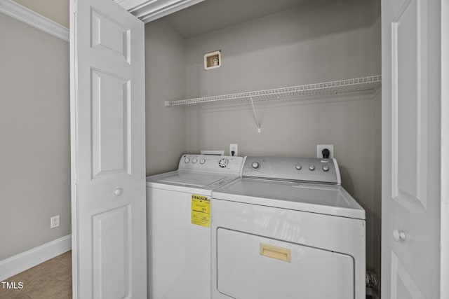 305 Justice Heights St, Apex, NC 27502 - washroom with washing machine and dryer and tile patterned floors