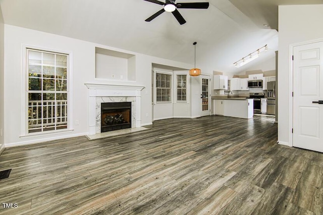 190 Hardwood Dr, Franklinton, NC 27525 - unfurnished living room with ceiling fan, dark wood-style flooring, and a high end fireplace