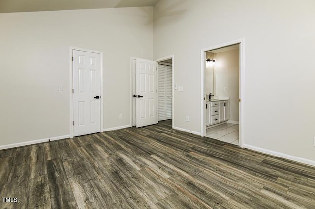 190 Hardwood Dr, Franklinton, NC 27525 - unfurnished bedroom featuring wood finished floors, high vaulted ceiling, and ensuite bathroom