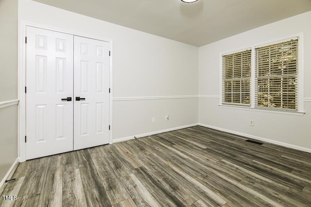 190 Hardwood Dr, Franklinton, NC 27525 - unfurnished bedroom with wood finished floors and a closet