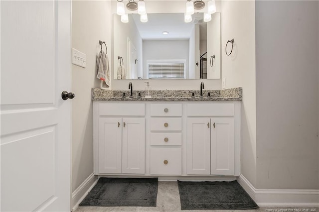 1234 Micahs Way N, Spring Lake, NC 28390 - full bathroom with double vanity and baseboards