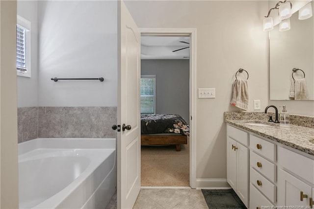 1234 Micahs Way N, Spring Lake, NC 28390 - ensuite bathroom featuring vanity, a garden tub, and tile patterned flooring