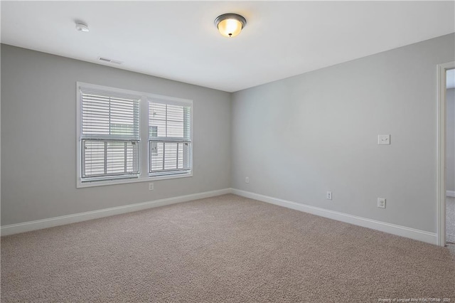1234 Micahs Way N, Spring Lake, NC 28390 - spare room with carpet flooring and a smoke detector