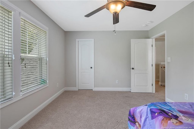 1234 Micahs Way N, Spring Lake, NC 28390 - carpeted bedroom with multiple windows and ceiling fan