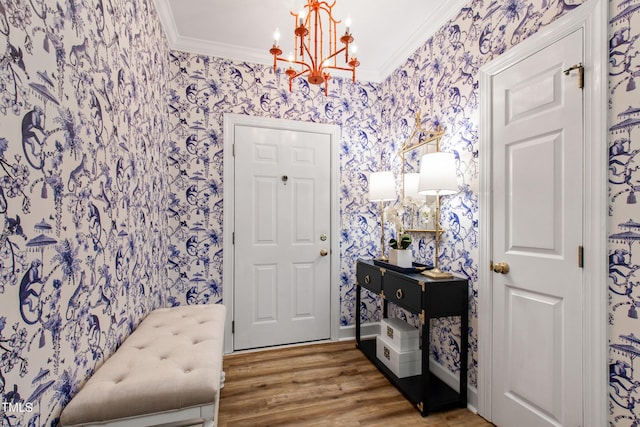 116 Northbrook Dr Unit 303, Raleigh, NC 27609 - foyer entrance featuring wallpapered walls, ornamental molding, a chandelier, and wood finished floors