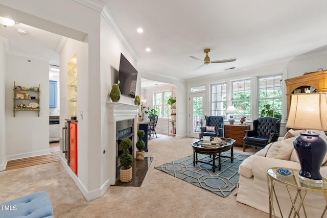 116 Northbrook Dr Unit 303, Raleigh, NC 27609 - carpeted living room featuring ornamental molding, ceiling fan, a fireplace with flush hearth, and recessed lighting
