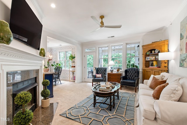 116 Northbrook Dr Unit 303, Raleigh, NC 27609 - carpeted living area featuring ornamental molding, ceiling fan, and a premium fireplace