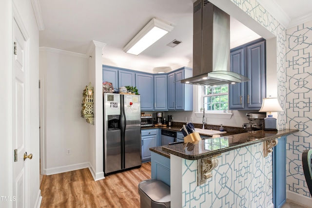 116 Northbrook Dr Unit 303, Raleigh, NC 27609 - kitchen with appliances with stainless steel finishes, blue cabinetry, island range hood, a peninsula, and a breakfast bar