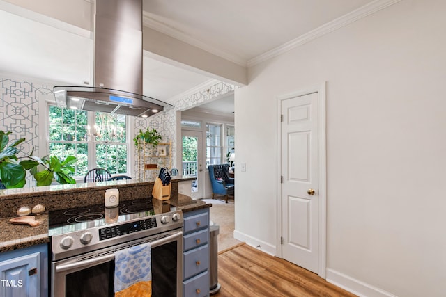 116 Northbrook Dr Unit 303, Raleigh, NC 27609 - kitchen with stainless steel electric range, exhaust hood, ornamental molding, light wood-type flooring, and dark stone countertops