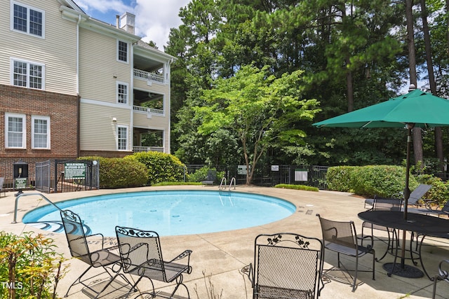 116 Northbrook Dr Unit 303, Raleigh, NC 27609 - community pool featuring a patio area