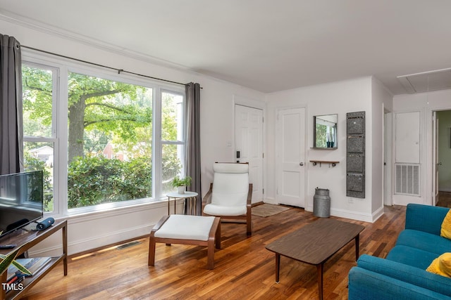 2331 Stevens Rd, Raleigh, NC 27610 - sitting room featuring attic access, wood finished floors, and plenty of natural light