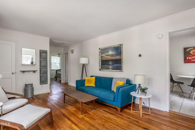 2331 Stevens Rd, Raleigh, NC 27610 - living area featuring wood finished floors, ornamental molding, and attic access