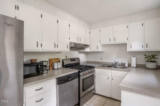 2331 Stevens Rd, Raleigh, NC 27610 - kitchen with appliances with stainless steel finishes, under cabinet range hood, light countertops, and white cabinetry