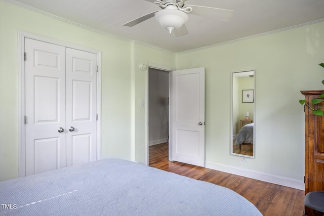 2331 Stevens Rd, Raleigh, NC 27610 - bedroom with wood finished floors, crown molding, a closet, and ceiling fan