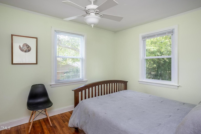 2331 Stevens Rd, Raleigh, NC 27610 - bedroom featuring multiple windows, wood finished floors, ornamental molding, and a ceiling fan