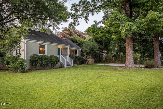 2331 Stevens Rd, Raleigh, NC 27610 - view of front of house with a chimney and roof with shingles