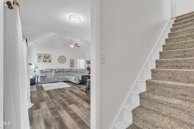 450 Cotton Mill Dr, Zebulon, NC 27597 - stairs featuring a ceiling fan, wood finished floors, high vaulted ceiling, and a barn door