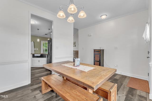450 Cotton Mill Dr, Zebulon, NC 27597 - dining room featuring dark wood finished floors, a chandelier, and ornamental molding