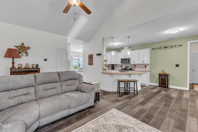 450 Cotton Mill Dr, Zebulon, NC 27597 - living area featuring a ceiling fan, dark wood finished floors, and high vaulted ceiling