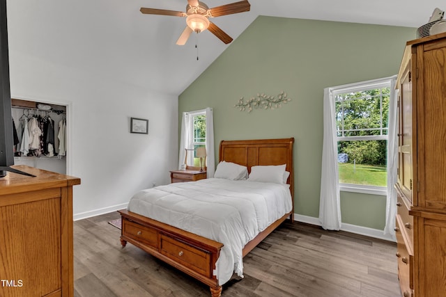 450 Cotton Mill Dr, Zebulon, NC 27597 - bedroom with high vaulted ceiling, wood finished floors, and a ceiling fan