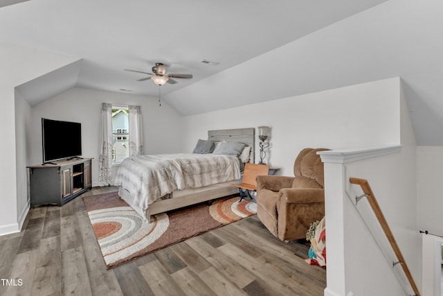 450 Cotton Mill Dr, Zebulon, NC 27597 - bedroom featuring wood finished floors, lofted ceiling, and ceiling fan