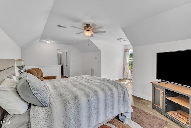 450 Cotton Mill Dr, Zebulon, NC 27597 - bedroom featuring light wood-style flooring, lofted ceiling, and a ceiling fan