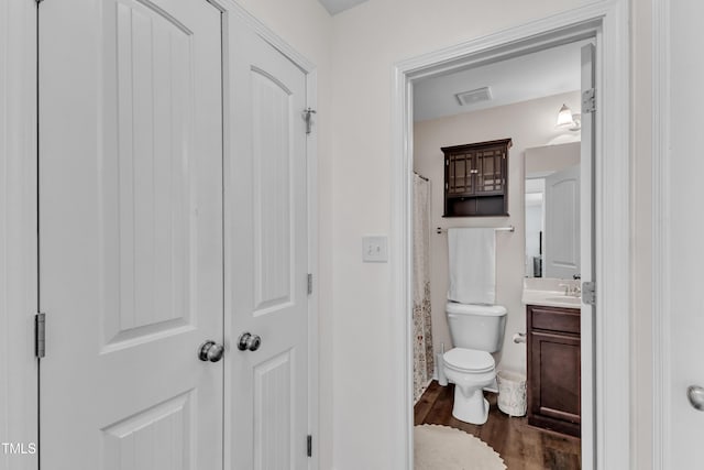 450 Cotton Mill Dr, Zebulon, NC 27597 - bathroom with vanity, wood finished floors, and a shower with curtain