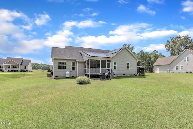 450 Cotton Mill Dr, Zebulon, NC 27597 - back of property with crawl space, a sunroom, and a lawn