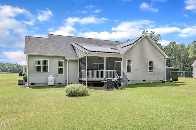 450 Cotton Mill Dr, Zebulon, NC 27597 - back of house with crawl space, a sunroom, roof mounted solar panels, and a lawn