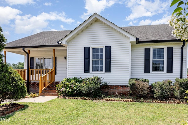 637 Convexa Ct, Wendell, NC 27591 - view of front facade featuring covered porch, a front yard, and roof with shingles