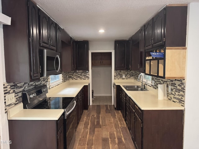 6740 Guess Rd, Hillsborough, NC 27278 - kitchen with stainless steel appliances, dark wood-type flooring, tasteful backsplash, light countertops, and recessed lighting