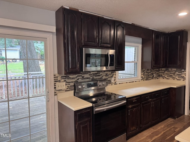 6740 Guess Rd, Hillsborough, NC 27278 - kitchen featuring stainless steel appliances, light countertops, backsplash, wood finished floors, and recessed lighting