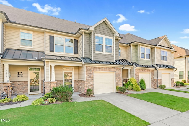 7817 Elmshire Way, Raleigh, NC 27616 - townhome / multi-family property featuring a standing seam roof, driveway, an attached garage, a front lawn, and roof with shingles