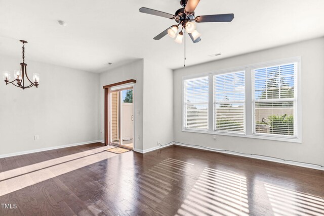 7817 Elmshire Way, Raleigh, NC 27616 - unfurnished room featuring a chandelier, wood finished floors, and ceiling fan