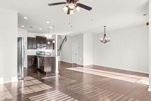 7817 Elmshire Way, Raleigh, NC 27616 - kitchen featuring appliances with stainless steel finishes, dark wood-style flooring, dark brown cabinets, a ceiling fan, and recessed lighting