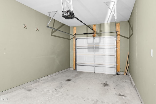 7817 Elmshire Way, Raleigh, NC 27616 - garage with a garage door opener and baseboards