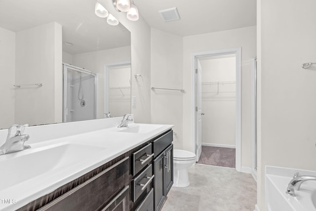 7817 Elmshire Way, Raleigh, NC 27616 - bathroom with a stall shower, a spacious closet, double vanity, and a garden tub