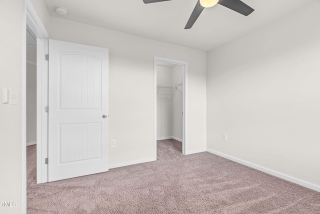 7817 Elmshire Way, Raleigh, NC 27616 - unfurnished bedroom featuring carpet, a spacious closet, and a ceiling fan
