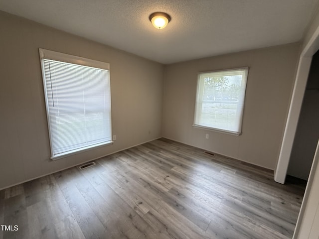 306 N Discovery St Unit A, B, C, D, Rocky Mount, NC 27801 - unfurnished bedroom with wood finished floors and a textured ceiling