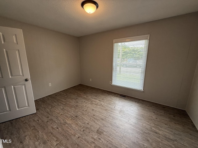 306 N Discovery St Unit A, B, C, D, Rocky Mount, NC 27801 - spare room with wood finished floors and a textured ceiling