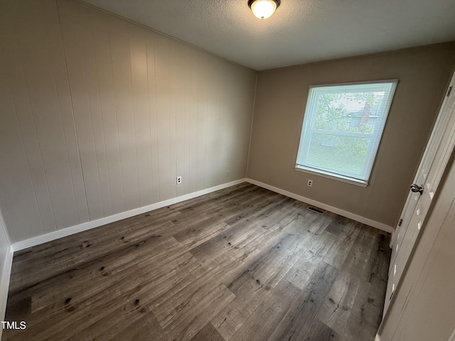 306 N Discovery St Unit A, B, C, D, Rocky Mount, NC 27801 - empty room featuring wood finished floors and a textured ceiling