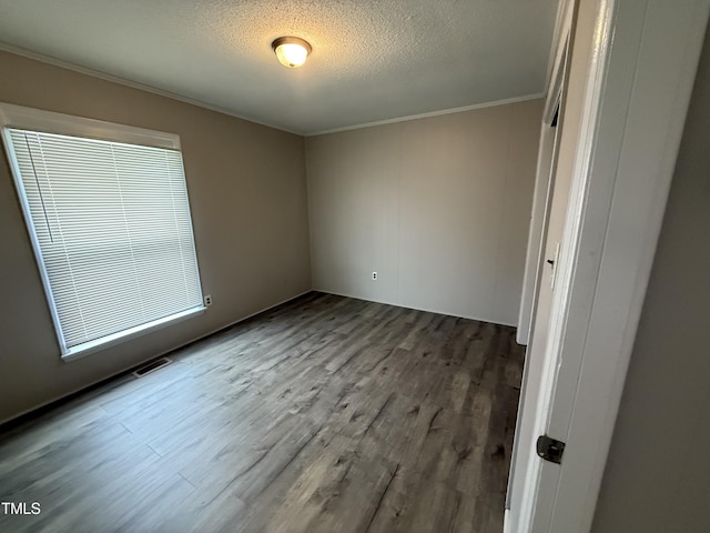 306 N Discovery St Unit A, B, C, D, Rocky Mount, NC 27801 - unfurnished bedroom featuring wood finished floors, crown molding, and a textured ceiling