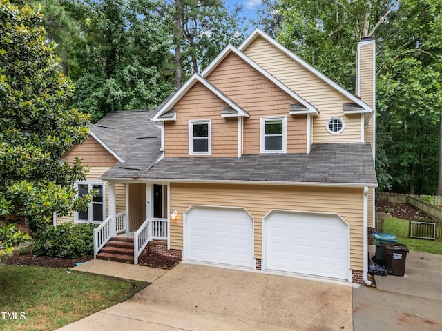 3 Fieldcrest Ct, Durham, NC 27713 - view of front of home with a garage, a chimney, and concrete driveway