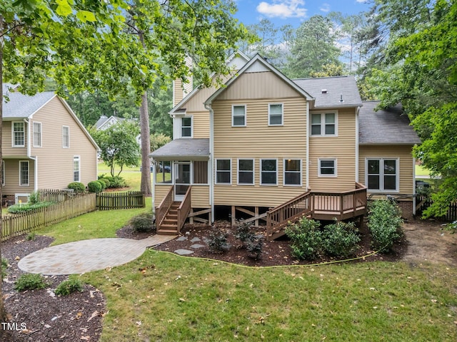 3 Fieldcrest Ct, Durham, NC 27713 - back of house with stairs, a chimney, a sunroom, a shingled roof, and a deck