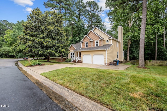 3 Fieldcrest Ct, Durham, NC 27713 - traditional home with driveway, a chimney, an attached garage, and view of wooded area