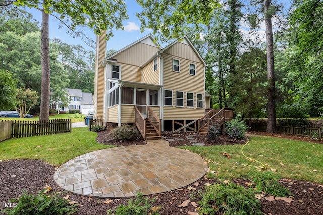 3 Fieldcrest Ct, Durham, NC 27713 - back of house featuring stairway, a sunroom, a patio area, a chimney, and a wooden deck