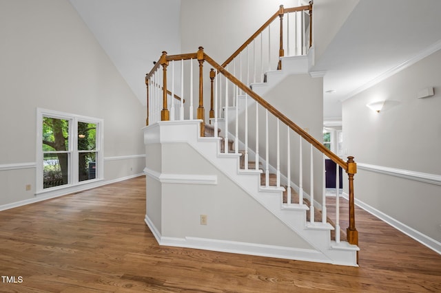 3 Fieldcrest Ct, Durham, NC 27713 - staircase with high vaulted ceiling, wood finished floors, and crown molding