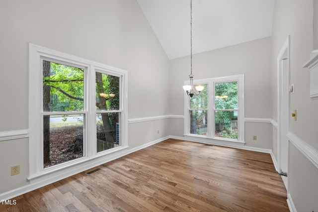 3 Fieldcrest Ct, Durham, NC 27713 - unfurnished dining area featuring a chandelier, wood finished floors, and high vaulted ceiling