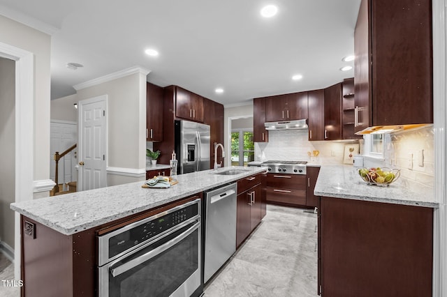3 Fieldcrest Ct, Durham, NC 27713 - kitchen featuring stainless steel appliances, ornamental molding, under cabinet range hood, tasteful backsplash, and a center island with sink