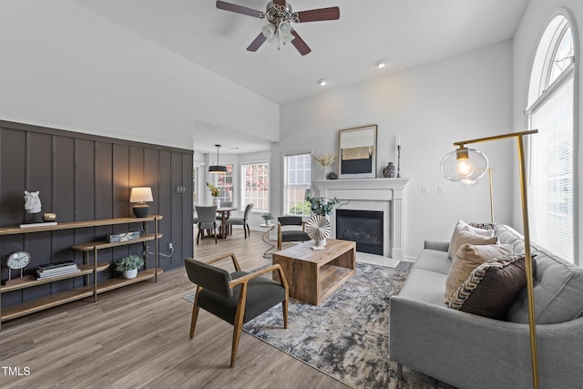 4812 Morecambe Way, Apex, NC 27539 - living area with ceiling fan, a premium fireplace, wood finished floors, and recessed lighting